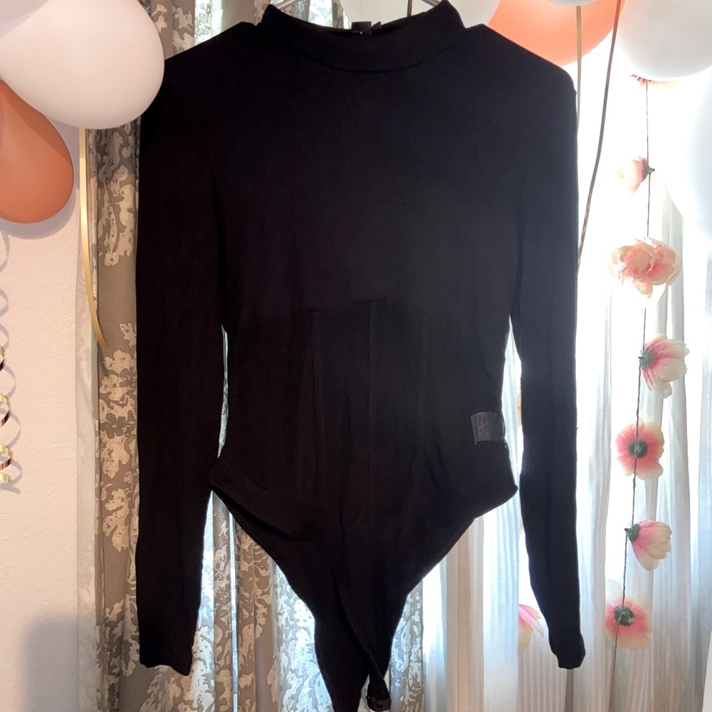 Never worn body suit size large